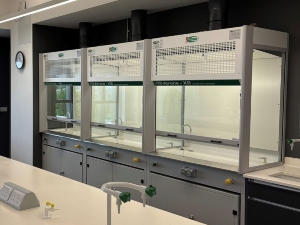Harrow School science laboratory with workstation and fume cupboards