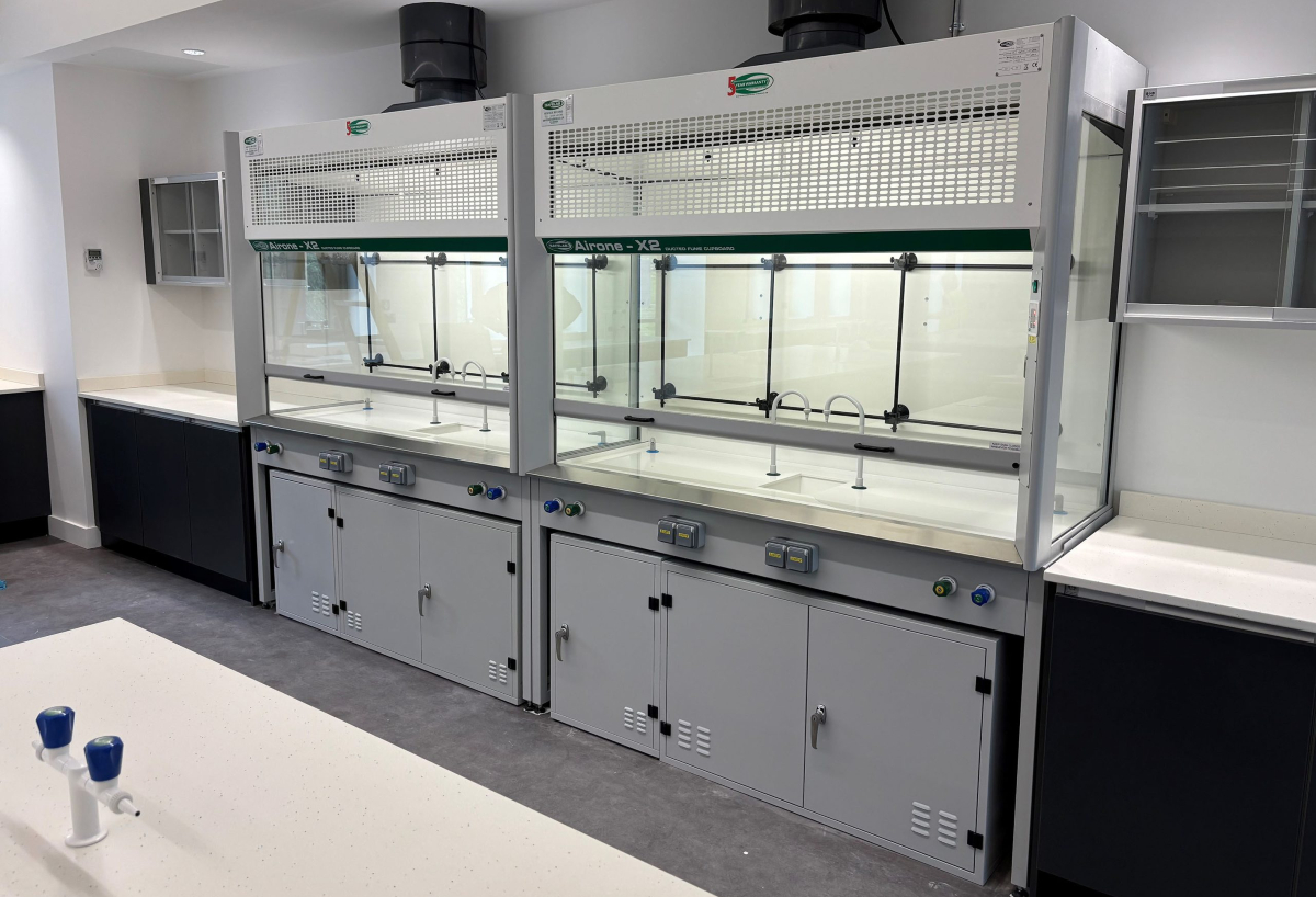 Multiple ducted fume cupboards installed in UK laboratory showing airflow and energy-efficient system design