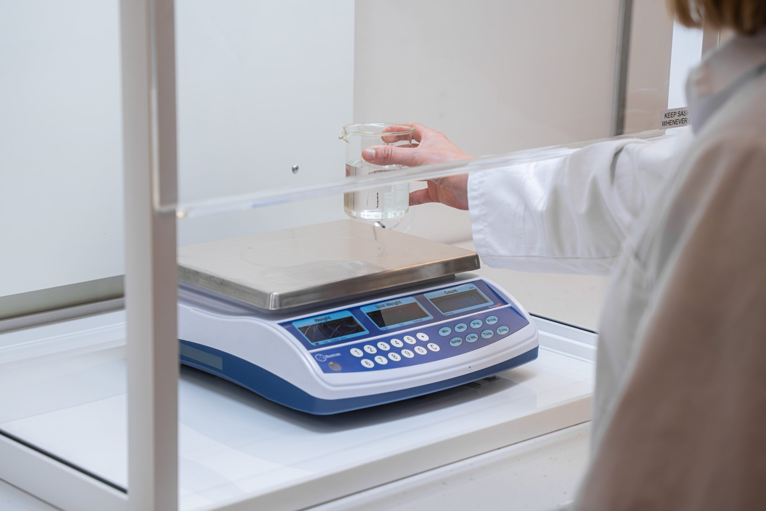 Laboratory user working safely at a Safelab fume cupboard